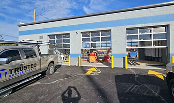 Six commercial full-view glass garage doors installed in Oak Park, Illinois by Trusted Garage Door